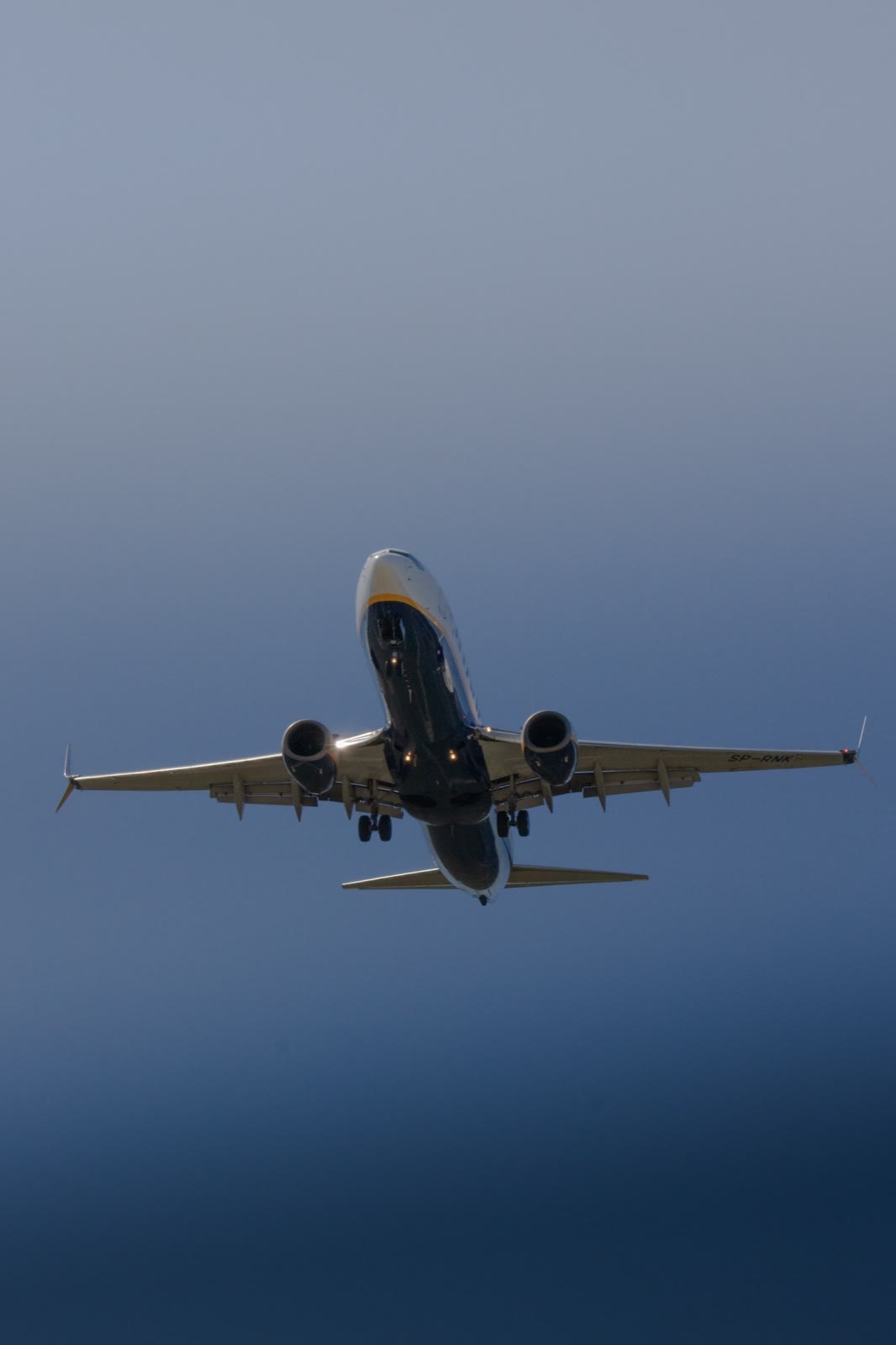 Airliner climbing into a deep blue sky